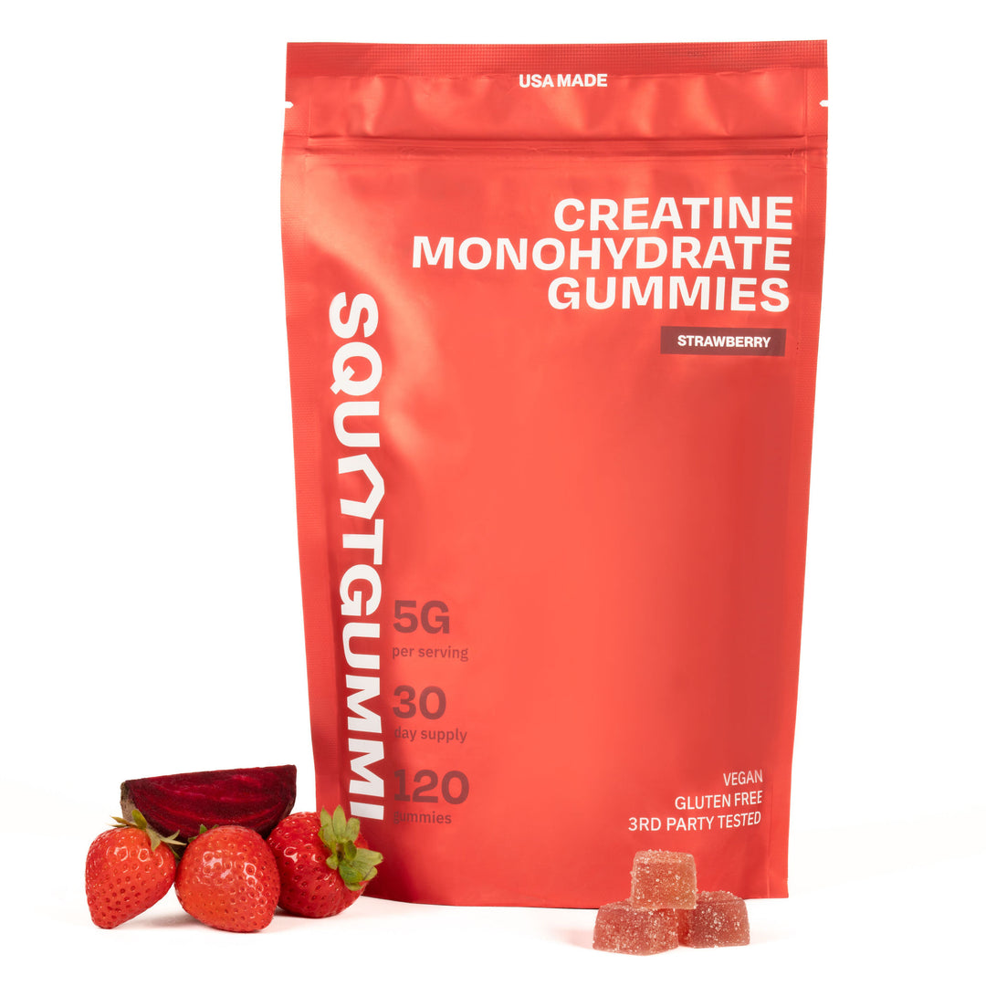 Red package of Squat Gummies creatine monohydrate gummies with strawberries on a white background